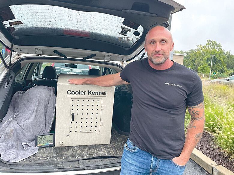 On a cool summer day, Jeremiah Raber of High Ridge shows off what his product, a Cooler Kennel, can do.